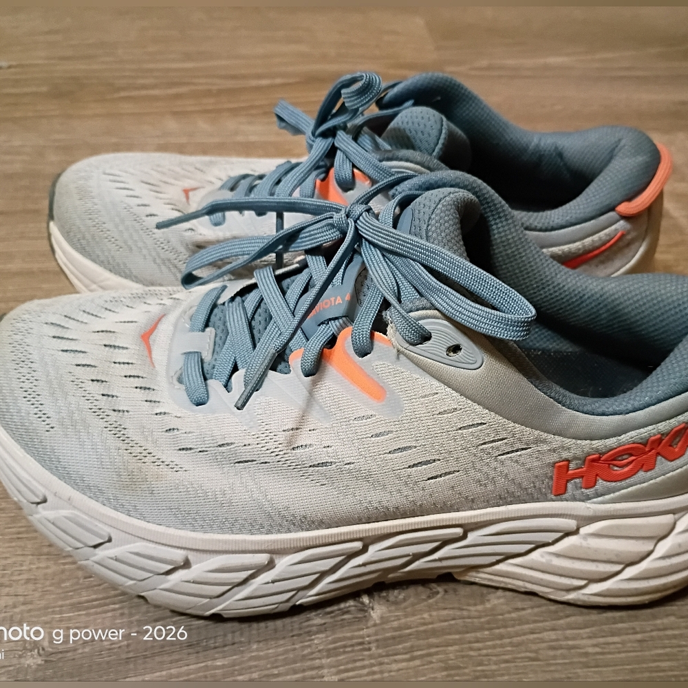 Hoka light blue women's running shoe interior with HOKA logo